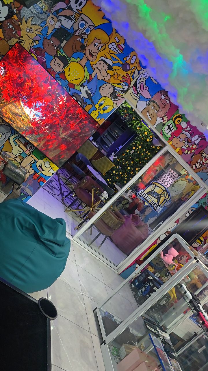 Inside Ravenz Realm: Cartoon Network mural, bean bags and glass display cabinets